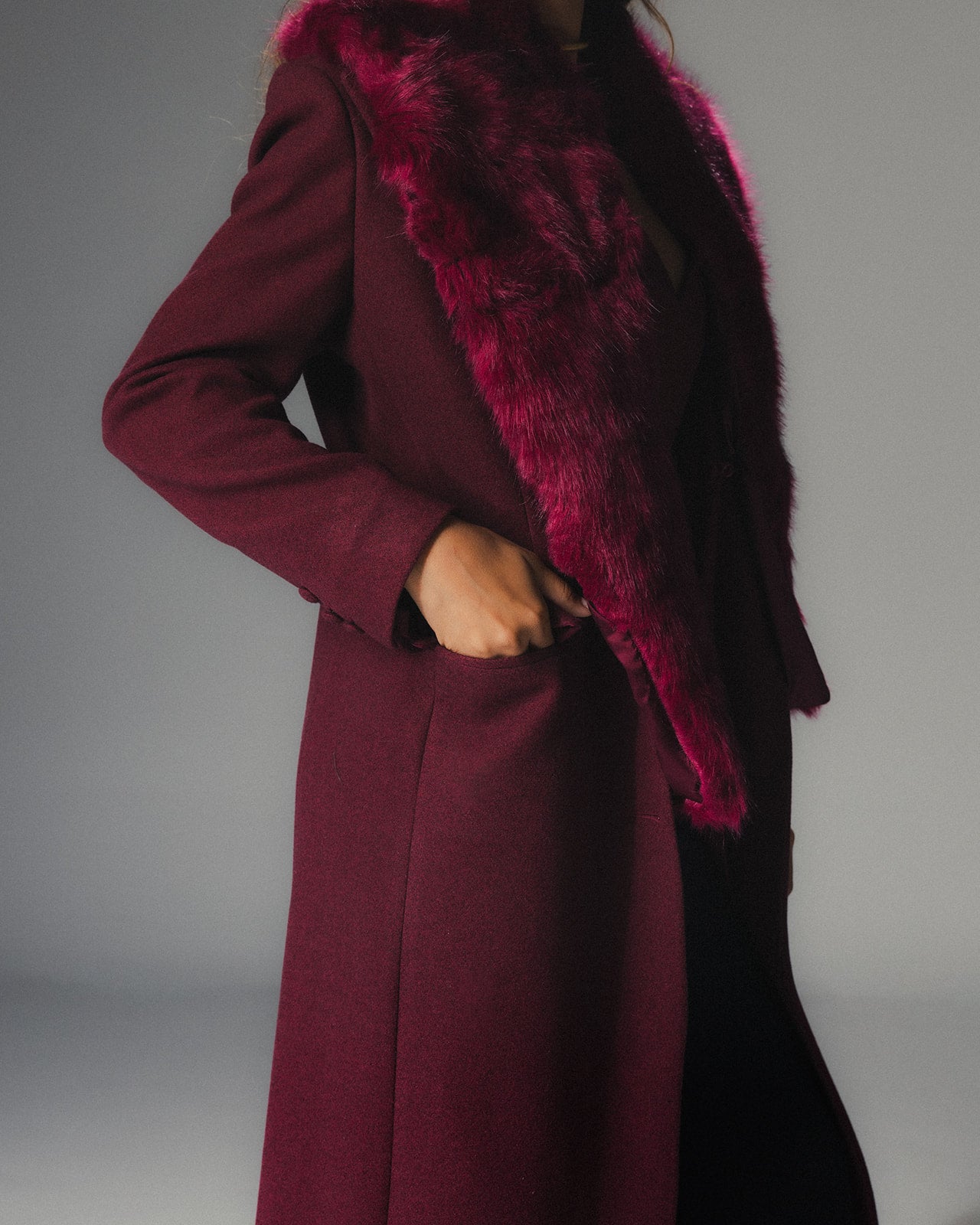 Close view of MYSHA Bordeaux burgundy wool coat with matching detachable fur collar.