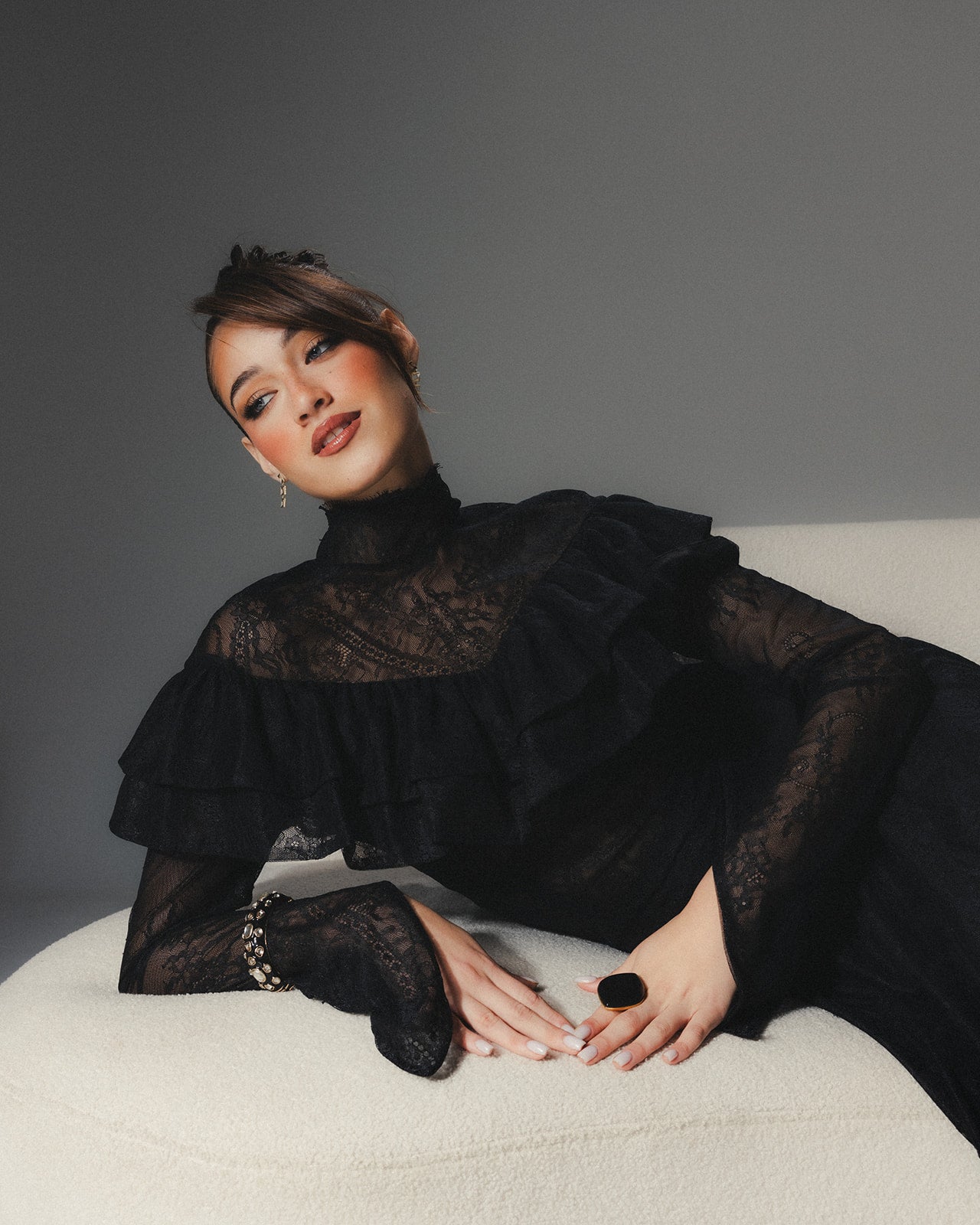 Close-up of MYSHA lace bodice showing the adjustable lace-up back straps and side zipper detail.