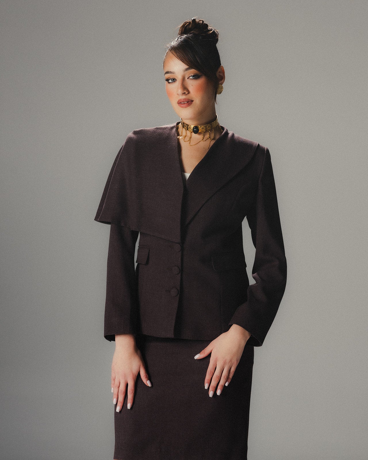 Model wearing the MYSHA Espresso brown blazer and matching tailored skirt for a complete feminine suit look