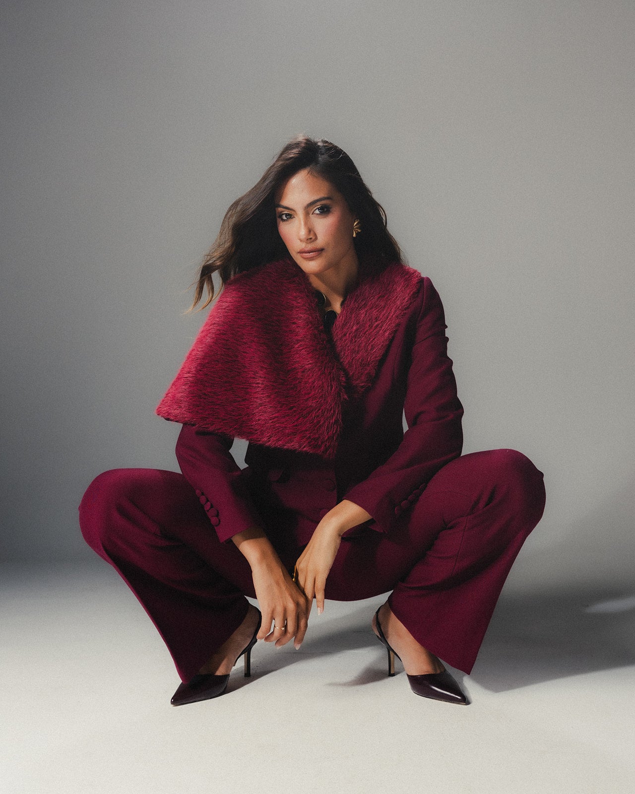 Model wearing MYSHA Bordeaux blazer with detachable fur collar - Front view