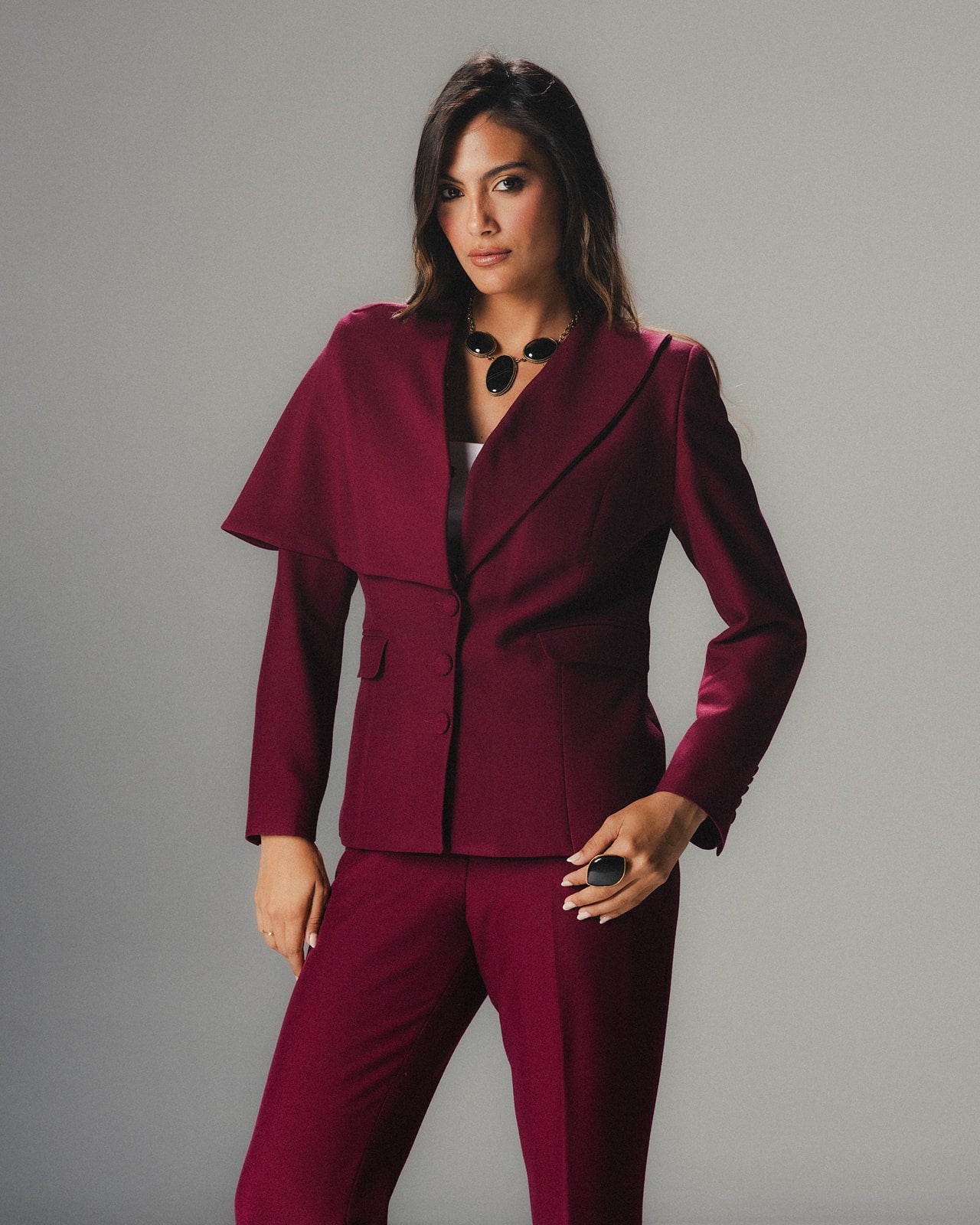 Model wearing MYSHA Bordeaux blazer with detachable fur collar - Front view