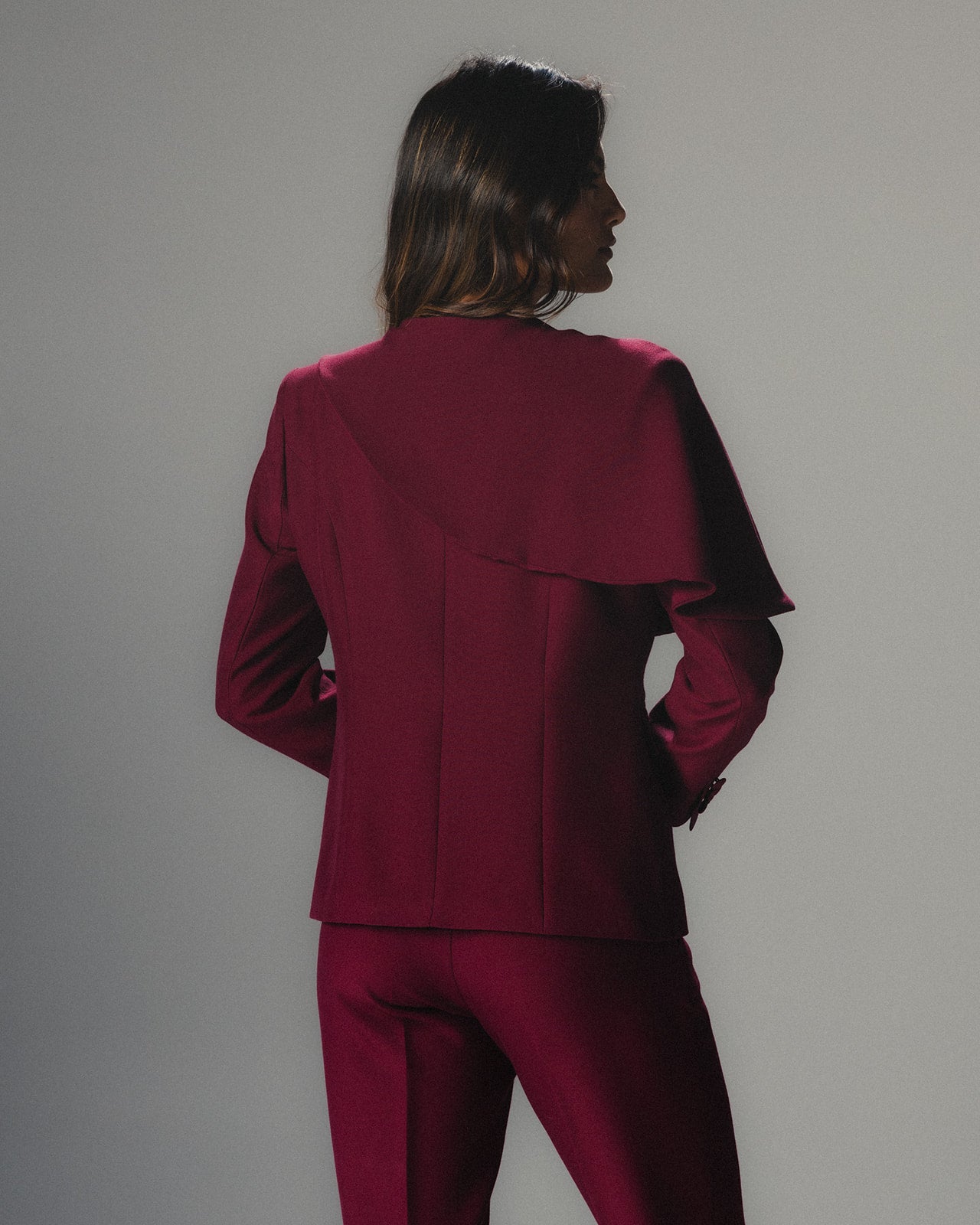 Model wearing MYSHA Bordeaux blazer with detachable fur collar - Back view