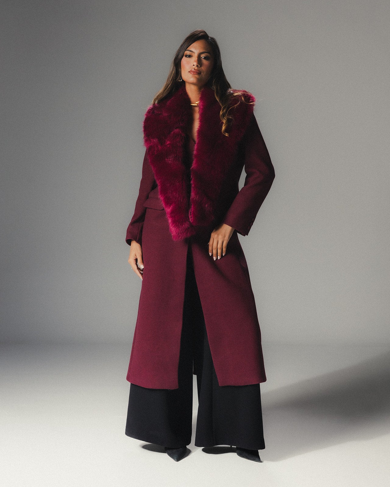Front view of MYSHA Bordeaux deep red wool coat with matching detachable fur collar.