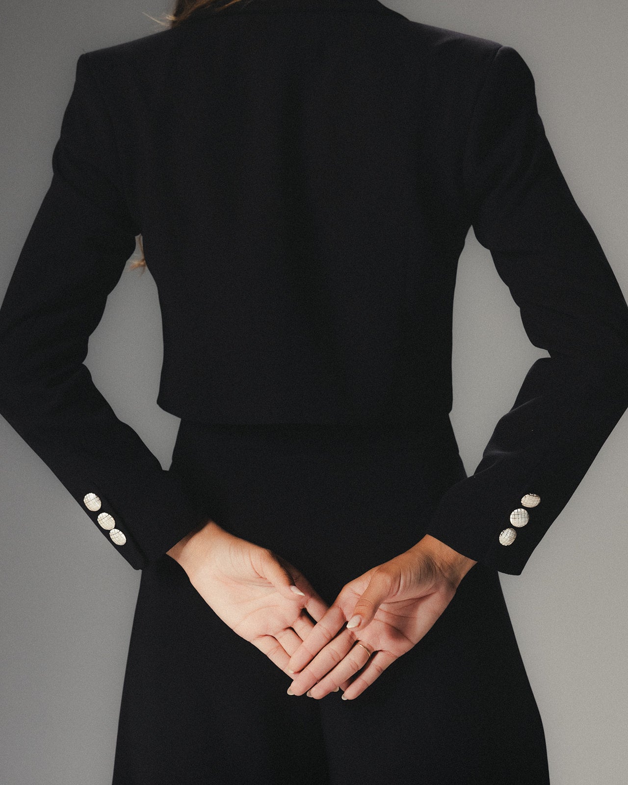 Model wearing MYSHA Midnight cropped blazer - back view