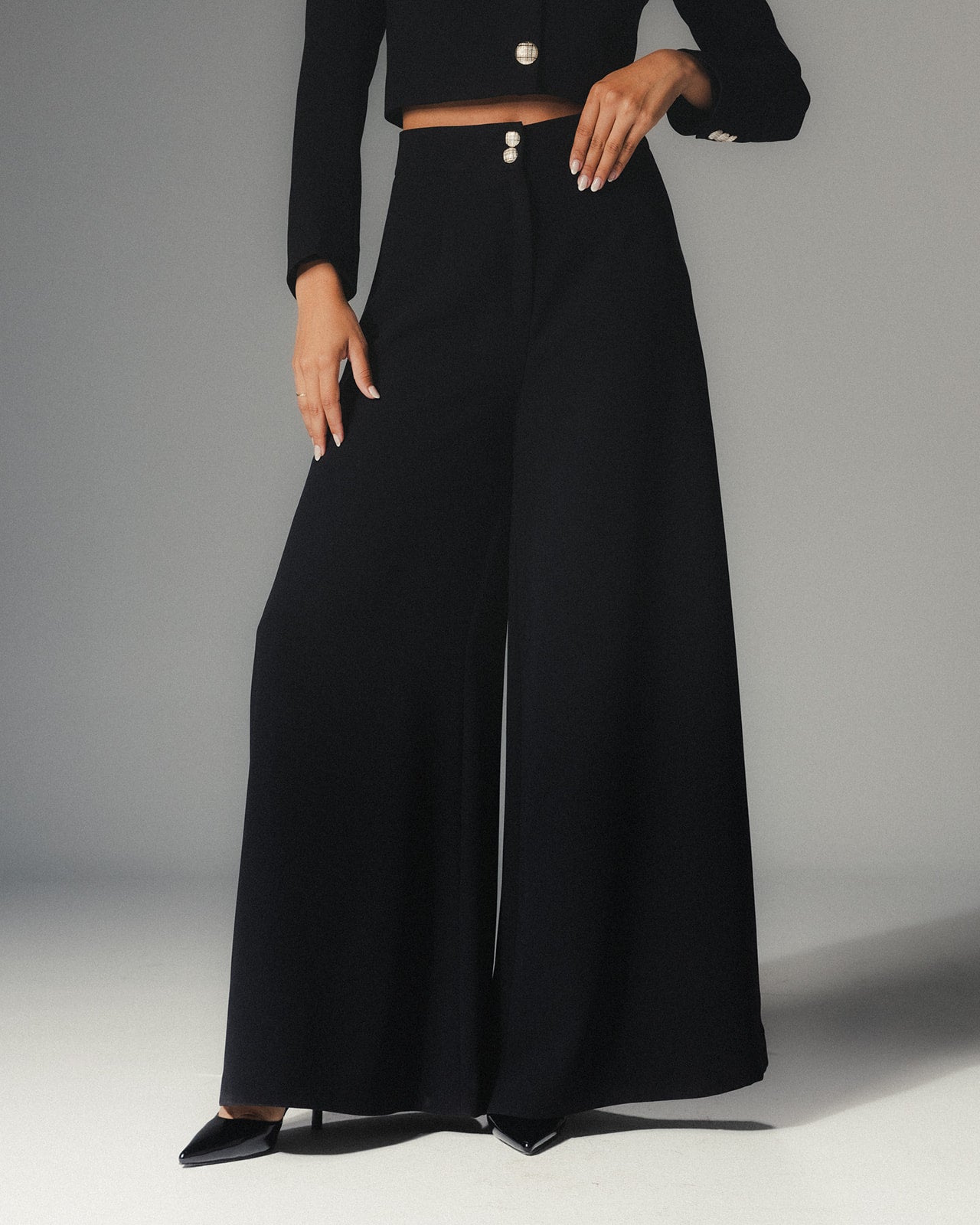Model wearing MYSHA Midnight wide-legged pants