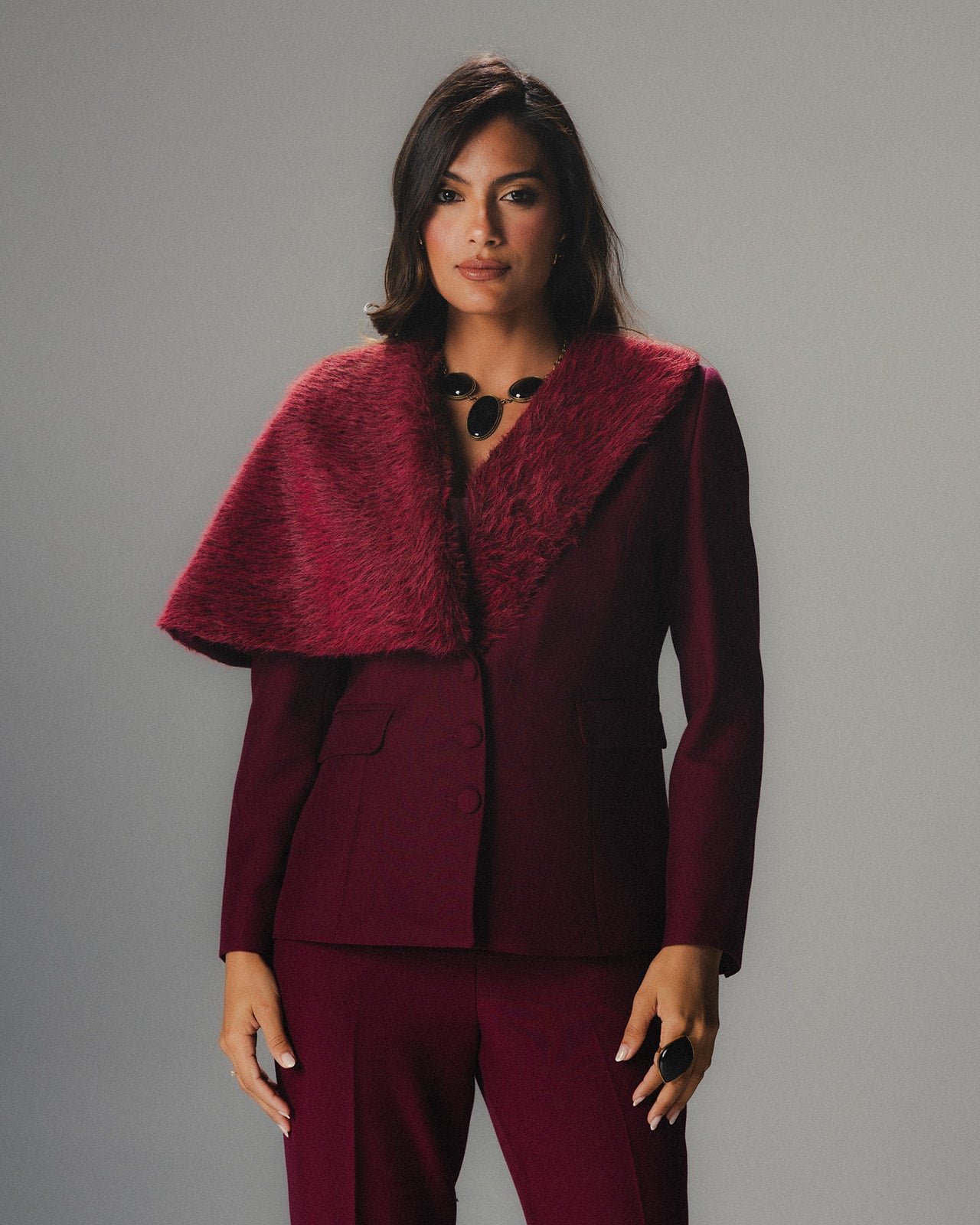 Model wearing MYSHA Bordeaux blazer with detachable fur collar - Front view