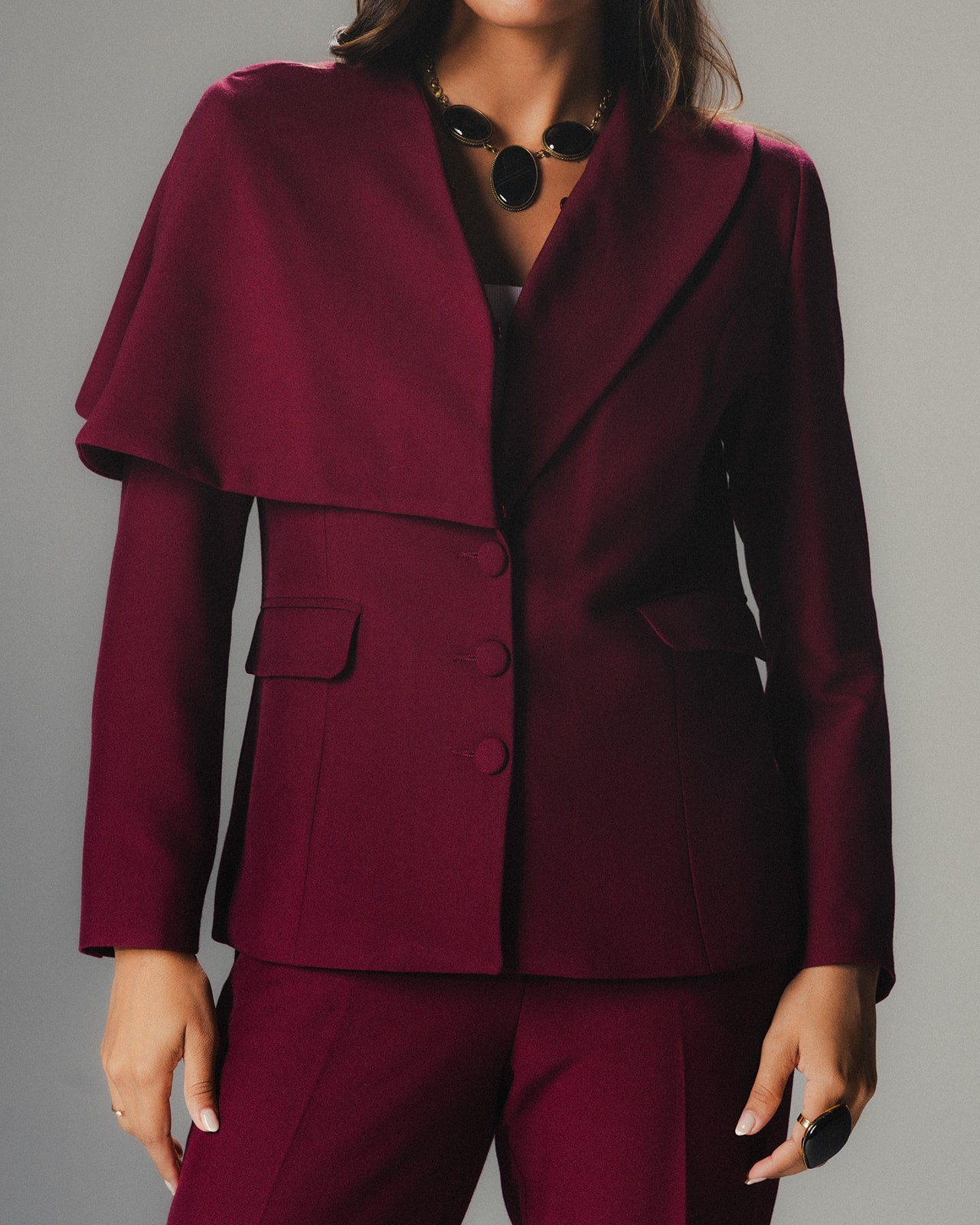 Model wearing MYSHA Bordeaux blazer with detachable fur collar - Close up view