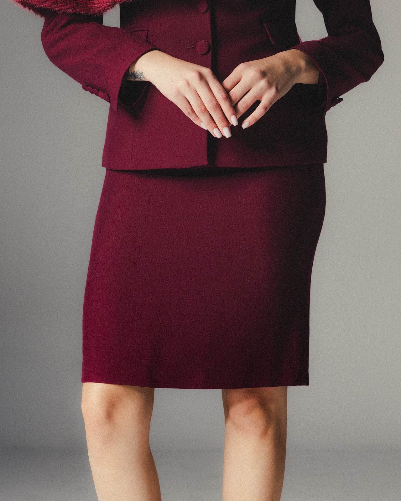 Model wearing MYSHA Bordeaux pencil skirt